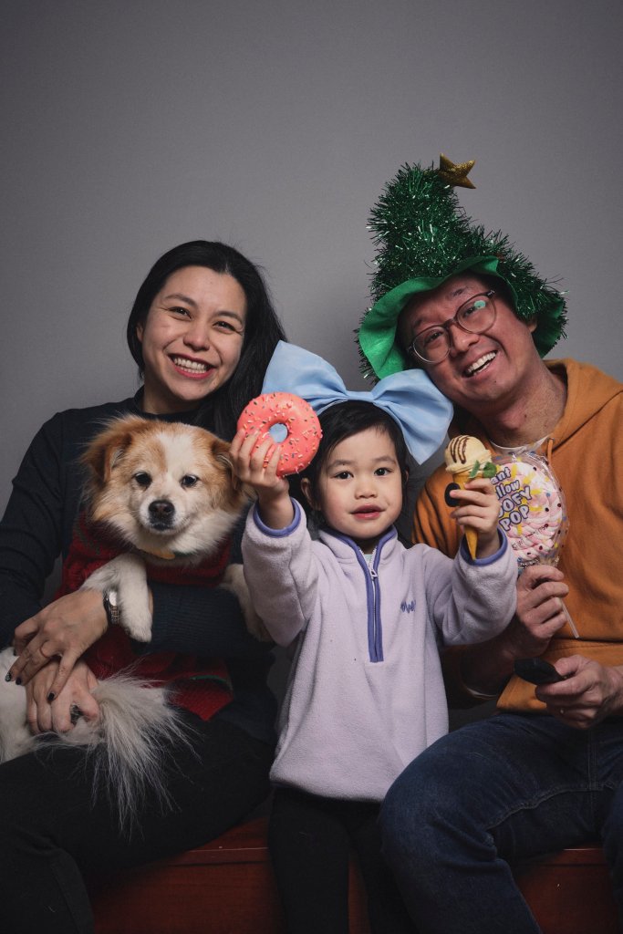 Naz with her husband, daughter and dog